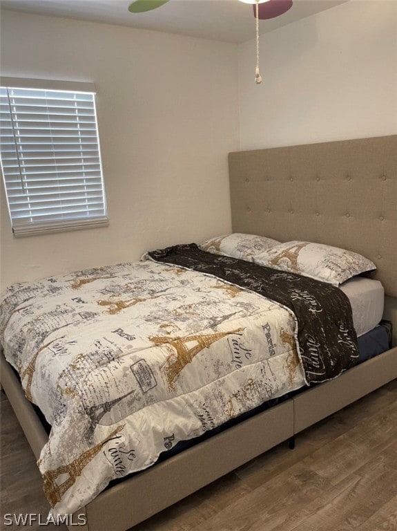 bedroom featuring dark wood-type flooring and ceiling fan