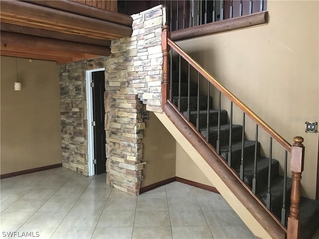 stairway with light tile flooring