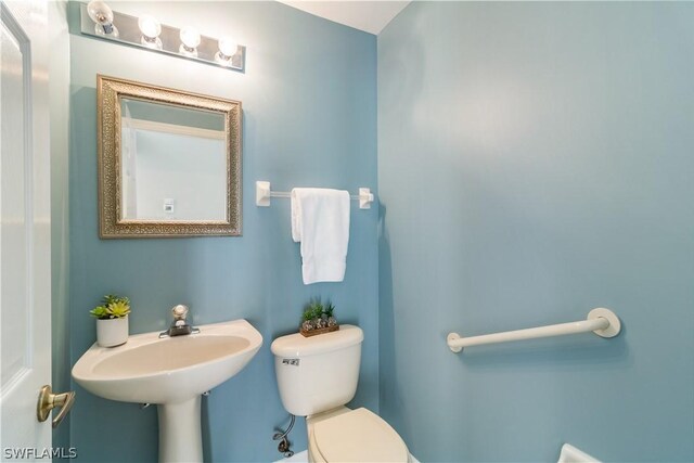 bathroom with sink and toilet