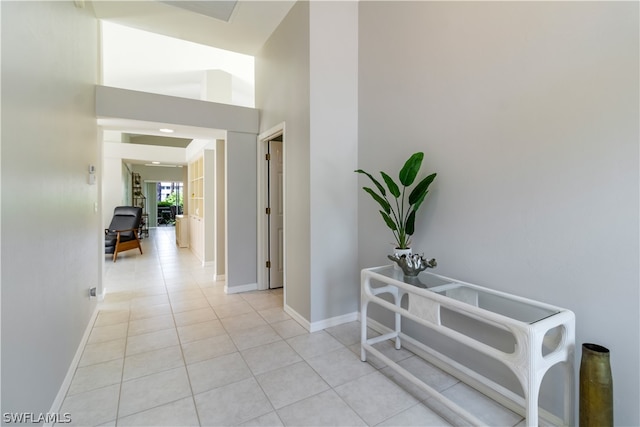 hall with light tile patterned flooring