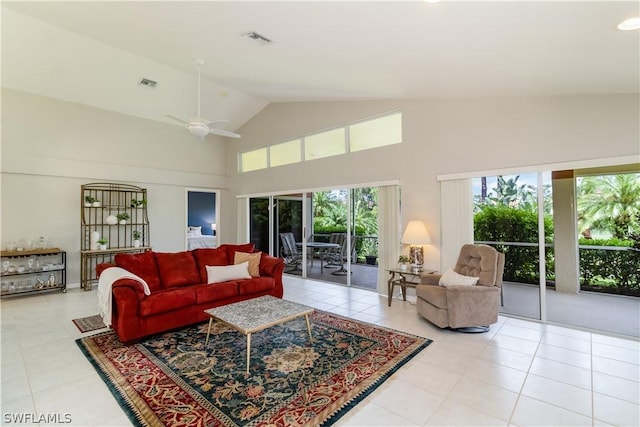 tiled living room featuring high vaulted ceiling and ceiling fan