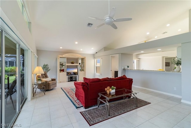 living room with ceiling fan, light tile patterned floors, and vaulted ceiling