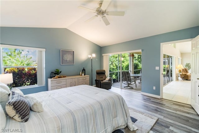 bedroom with ceiling fan, light hardwood / wood-style flooring, lofted ceiling, and access to outside