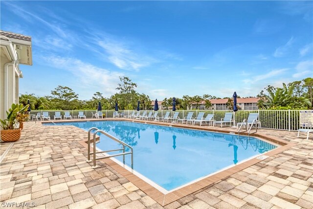 view of swimming pool featuring a patio