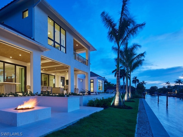 exterior space featuring a patio area and a fire pit