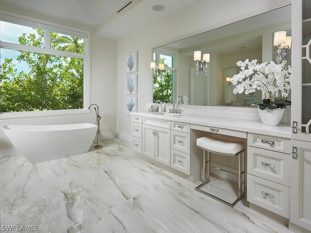 bathroom with vanity and a washtub