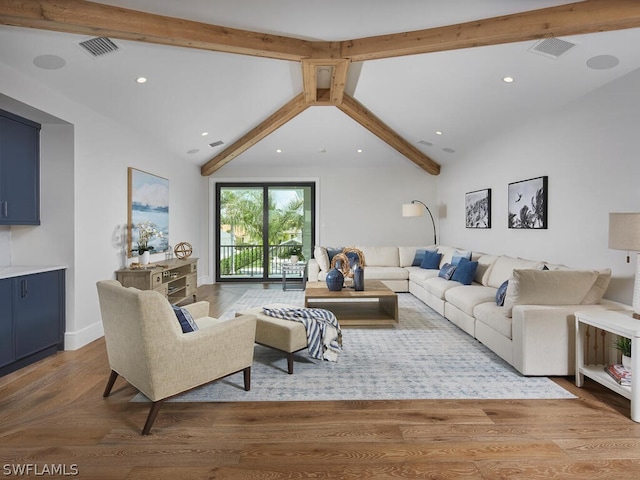 living room featuring light hardwood / wood-style flooring, high vaulted ceiling, and beamed ceiling