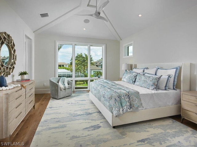 bedroom with lofted ceiling with beams, dark hardwood / wood-style flooring, and ceiling fan