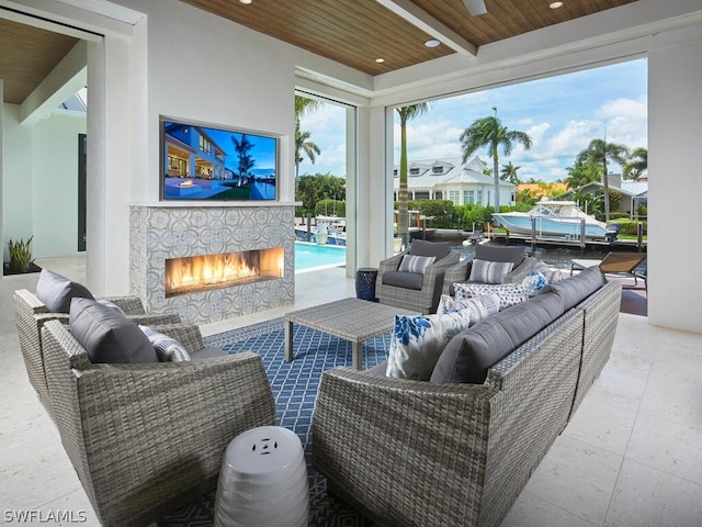 view of patio / terrace featuring an outdoor living space with a fireplace