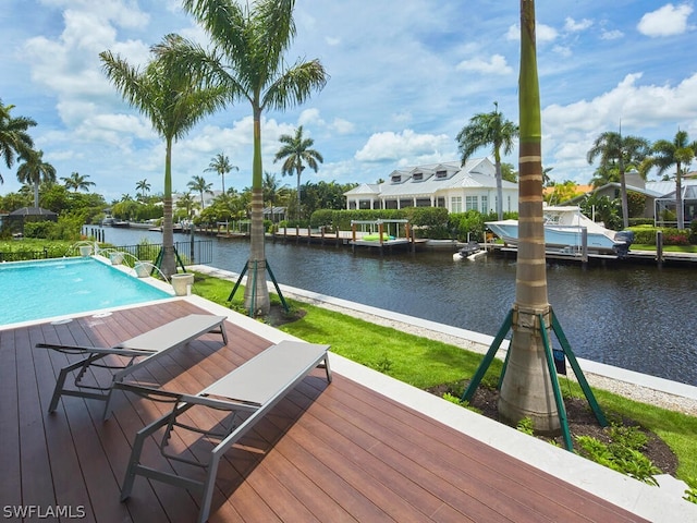 view of swimming pool with a water view