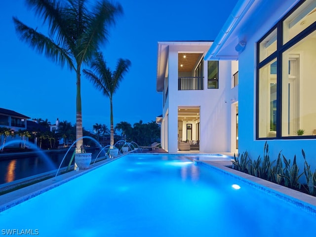 view of swimming pool featuring pool water feature