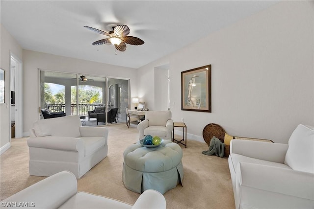 carpeted living room featuring ceiling fan