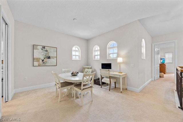 view of carpeted dining area