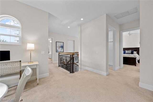 carpeted home office with ceiling fan