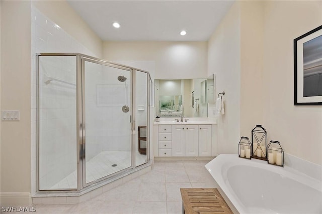 bathroom featuring tile patterned floors, vanity, and separate shower and tub