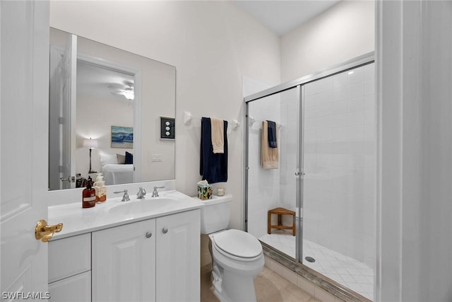 bathroom with vanity, an enclosed shower, and toilet