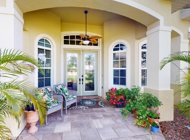 doorway to property with ceiling fan and french doors