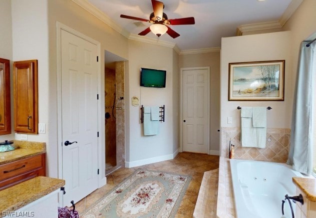 bathroom with tile flooring, ceiling fan, crown molding, tiled bath, and vanity