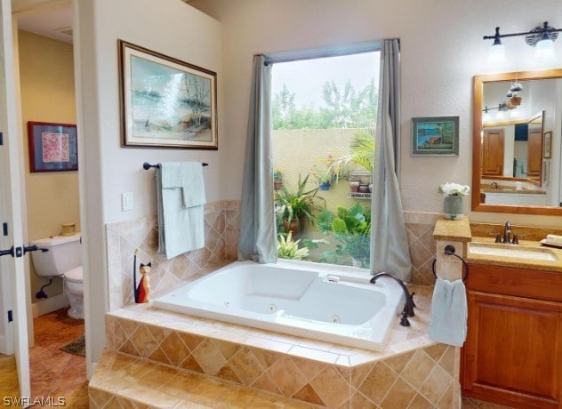 bathroom featuring vanity, toilet, and tile floors