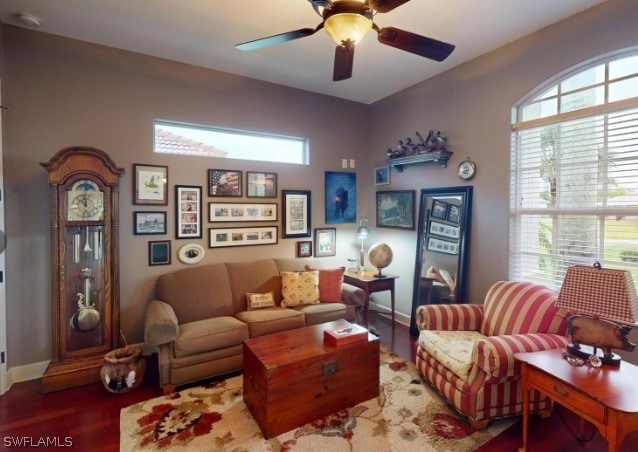 living room featuring ceiling fan and hardwood / wood-style flooring