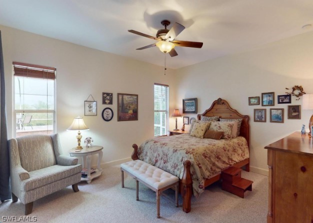 carpeted bedroom with ceiling fan