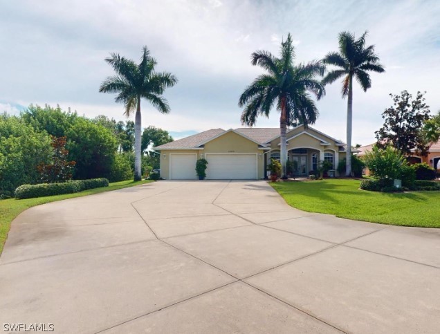 single story home with a front lawn and a garage