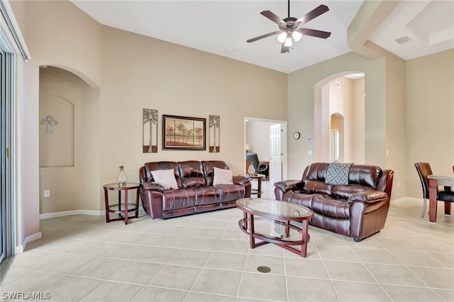 living room featuring ceiling fan and light tile patterned flooring