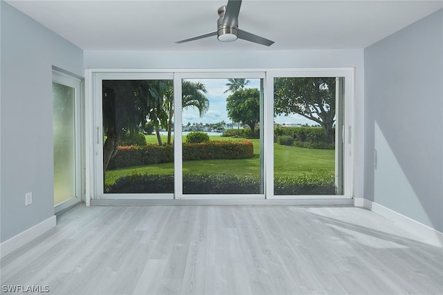 doorway to outside featuring light wood-type flooring and ceiling fan