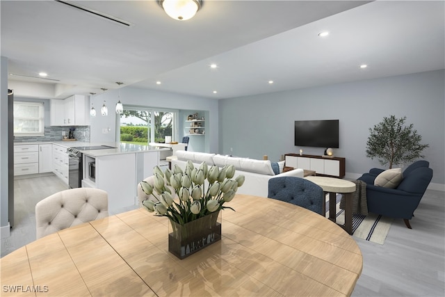 dining space featuring light hardwood / wood-style floors