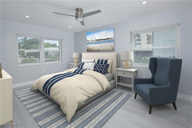 bedroom featuring light wood-type flooring and ceiling fan