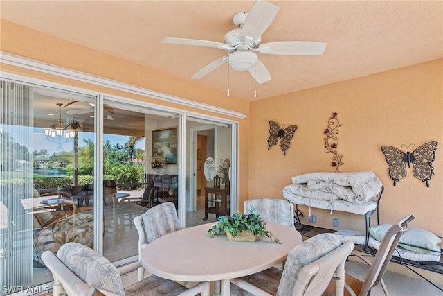 sunroom / solarium with ceiling fan