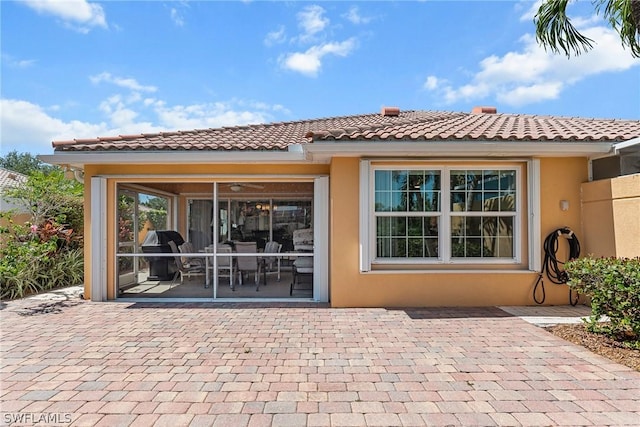 back of property with a patio area