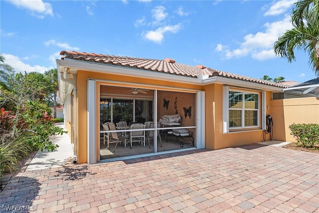 rear view of house featuring a patio