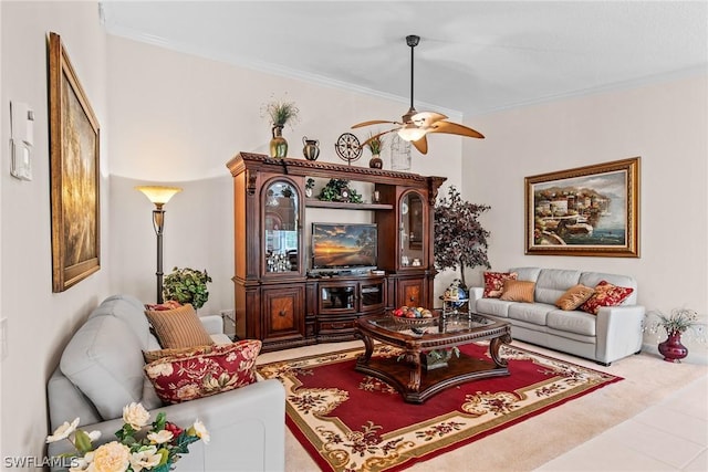 tiled living room with crown molding and ceiling fan