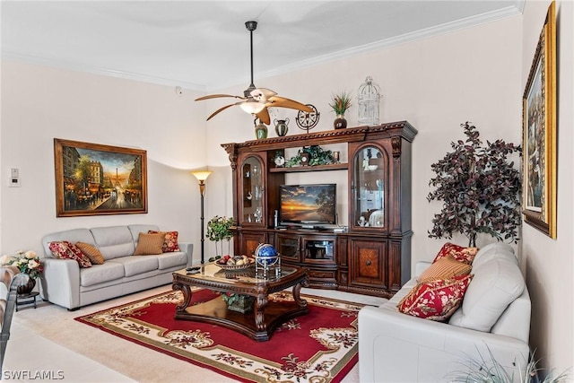 living room with ceiling fan and ornamental molding