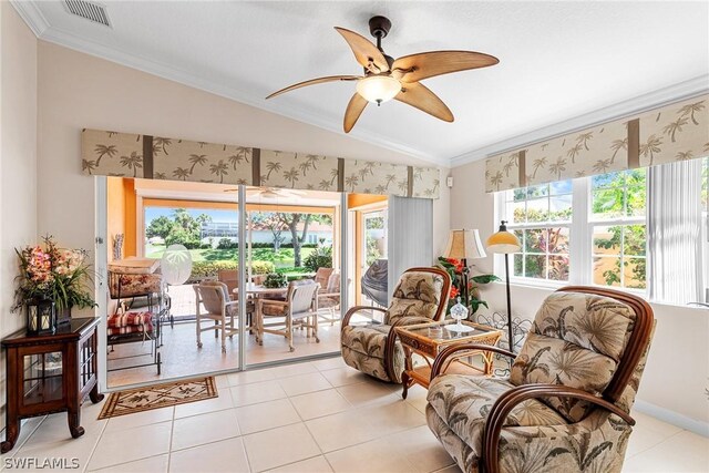 sunroom with ceiling fan, a healthy amount of sunlight, and lofted ceiling