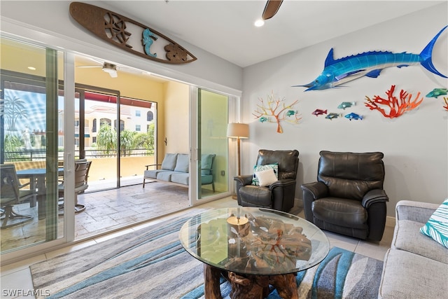 tiled living room with ceiling fan