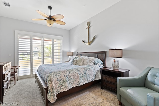 carpeted bedroom featuring access to exterior and ceiling fan