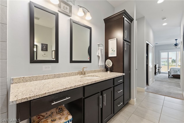 bathroom with tile patterned floors, ceiling fan, and vanity