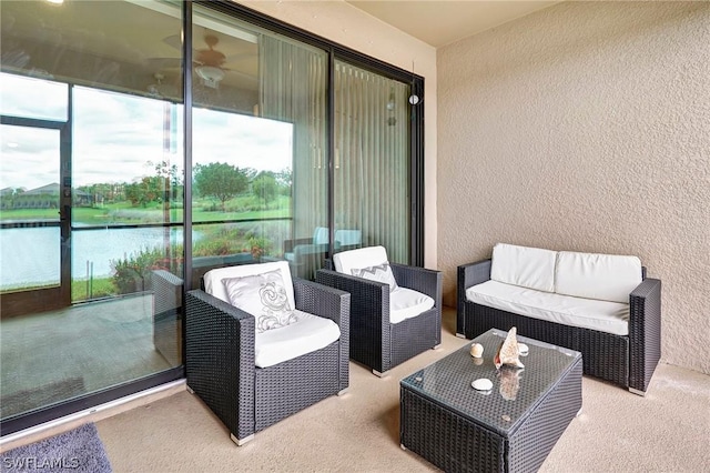 view of patio with a water view and an outdoor hangout area