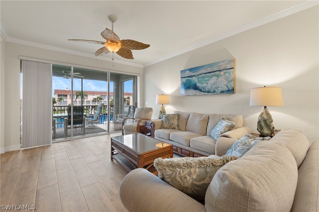 living room featuring ceiling fan, light wood-type flooring, and ornamental molding