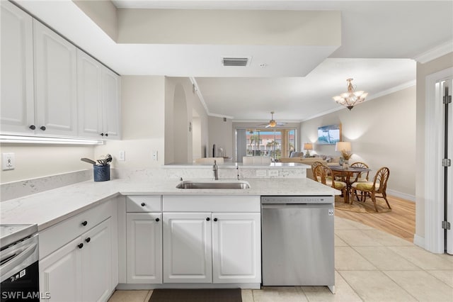 kitchen featuring sink, light tile patterned flooring, white cabinets, ceiling fan with notable chandelier, and appliances with stainless steel finishes