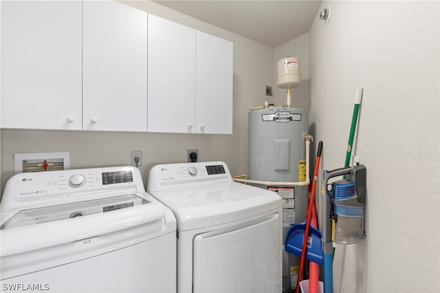 laundry room with cabinets and washer and dryer