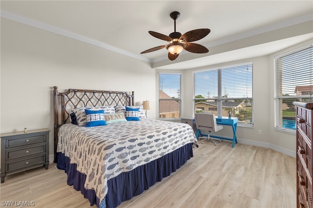 bedroom featuring ceiling fan, crown molding, and light hardwood / wood-style floors