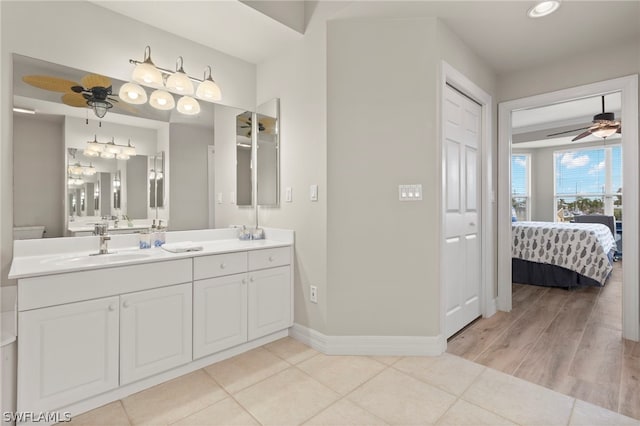 bathroom with tile patterned floors, ceiling fan, and vanity