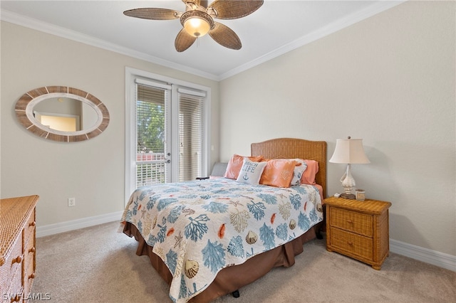 carpeted bedroom featuring ceiling fan and crown molding