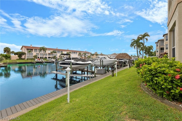 dock area featuring a yard and a water view