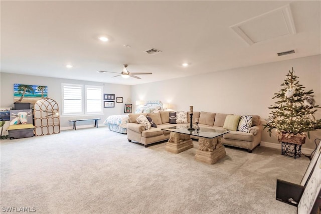 carpeted living room featuring ceiling fan