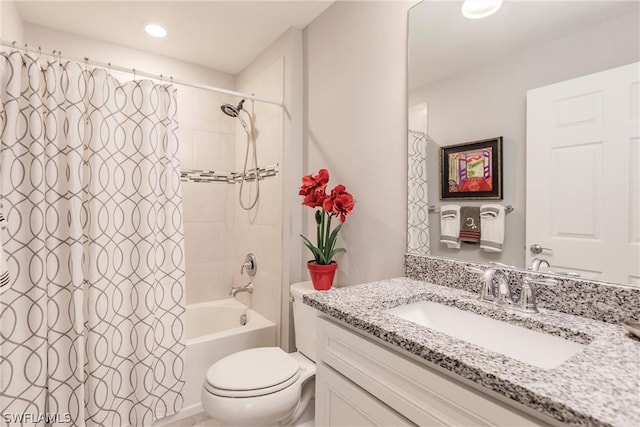 full bathroom featuring toilet, vanity, and shower / bathtub combination with curtain