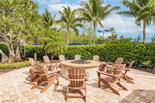 view of patio / terrace featuring an outdoor fire pit